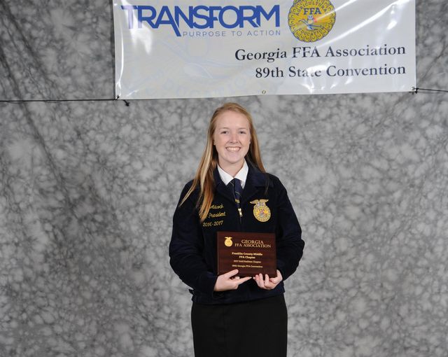 Vice President Grace Adcock accepted Franklin County Middle FFA chapter`s Gold Emblem Award